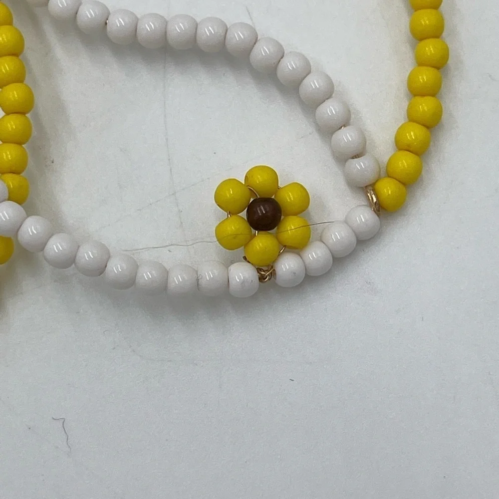 FREE PEOPLE AMONG THE‎ WILDFLOWERS HOOP YIN AND YANG YELLOW/WHITE  EARRINGS